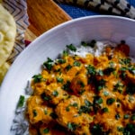 butter pheasant over rice with flatbread.