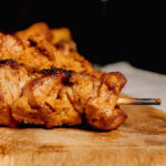 grouse skewer with orange sauce.