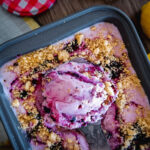 scoop of blueberry buttermilk ice cream in loaf pan.