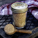 BBQ seasoning in jar with spoonful.
