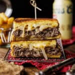 elk patty melt cut in half and stacked.