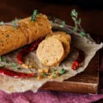 sliced cajun compound butter on parchment paper.