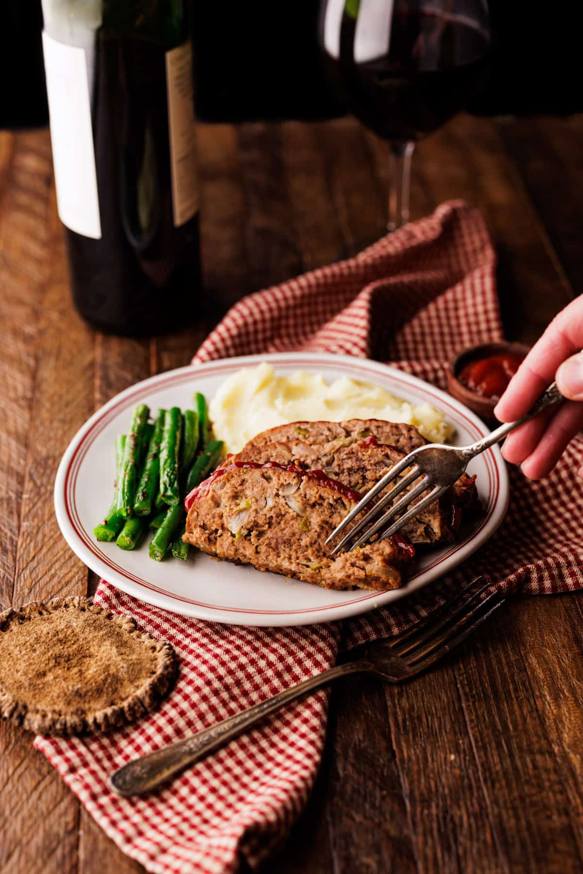 fork cutting into slice of elk meatloaf.