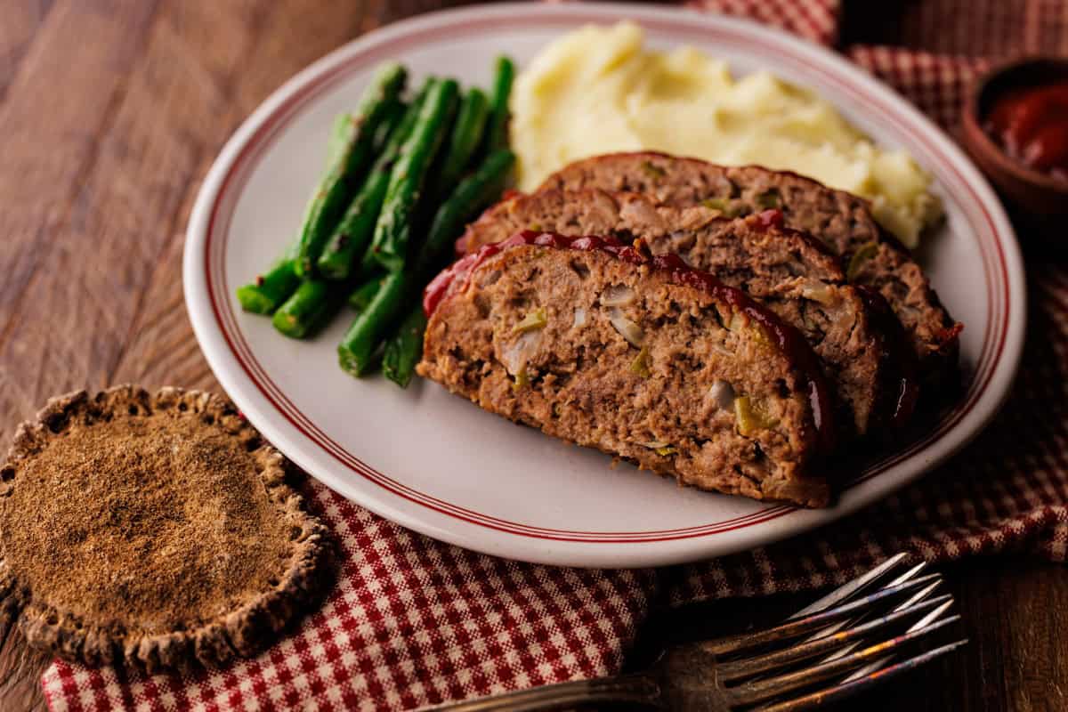 slices of elk meatloaf on plate.