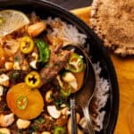 elk shank massaman curry in bowl with rice.