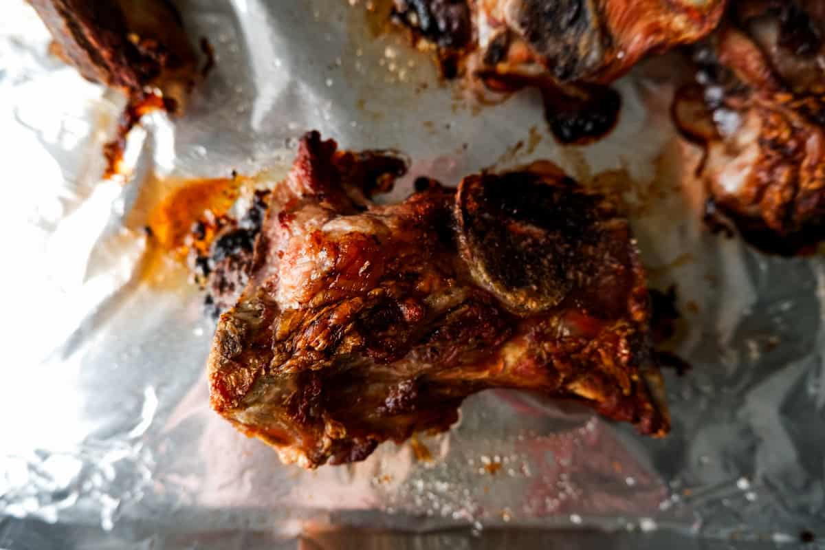 roasted pork bones on pan.