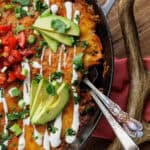 venison enchiladas in a skillet.