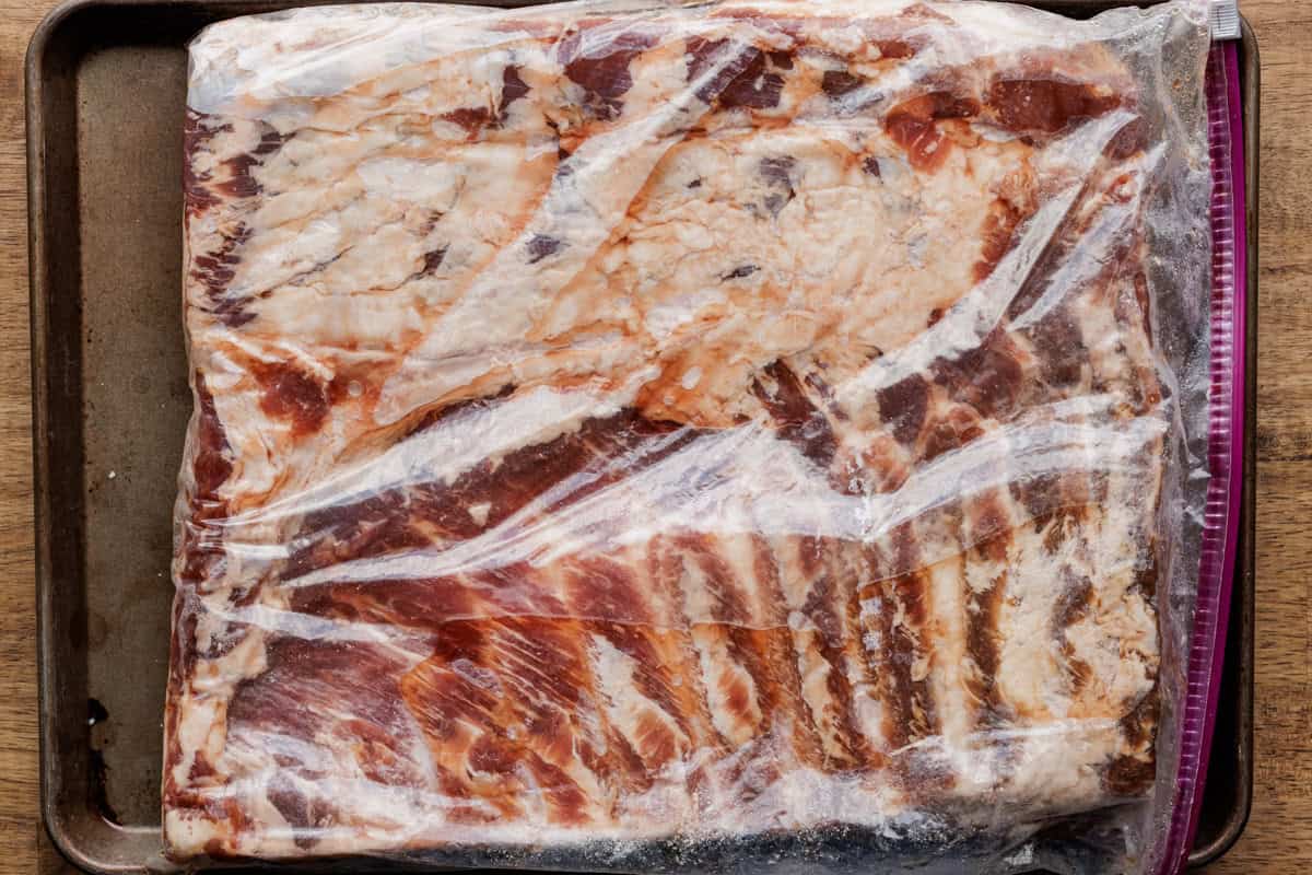 pork belly curing in large zippered bag.