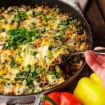 venison stuffed pepper casserole with serving spoon.