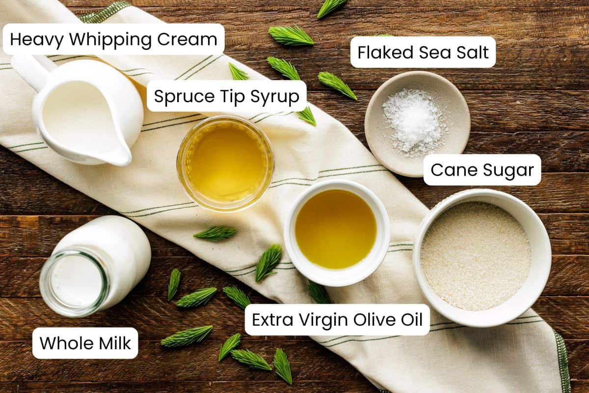 scoops of spruce tip olive oil ice cream in large dish of ice cream with labels.