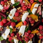 roasted beet salad with slices of goat cheese, raspberries, and chopped mint.