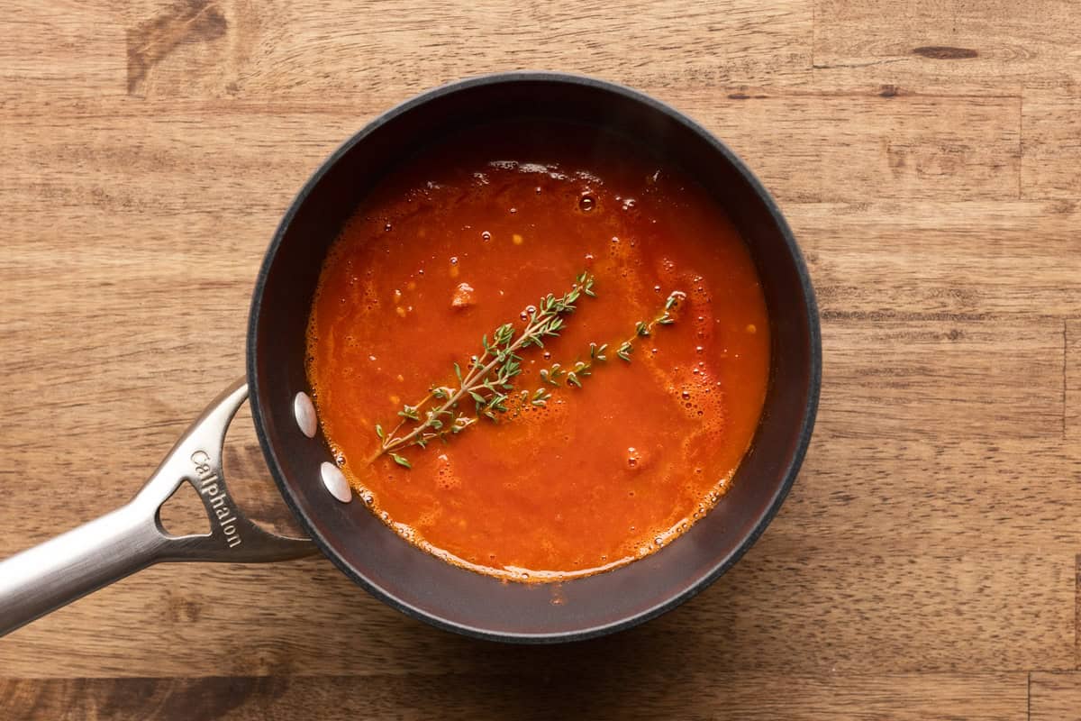 blended smoked tomatoes with thyme in saucepan.