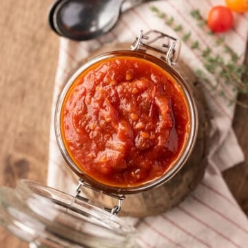 smoked tomato jam in glass jar.