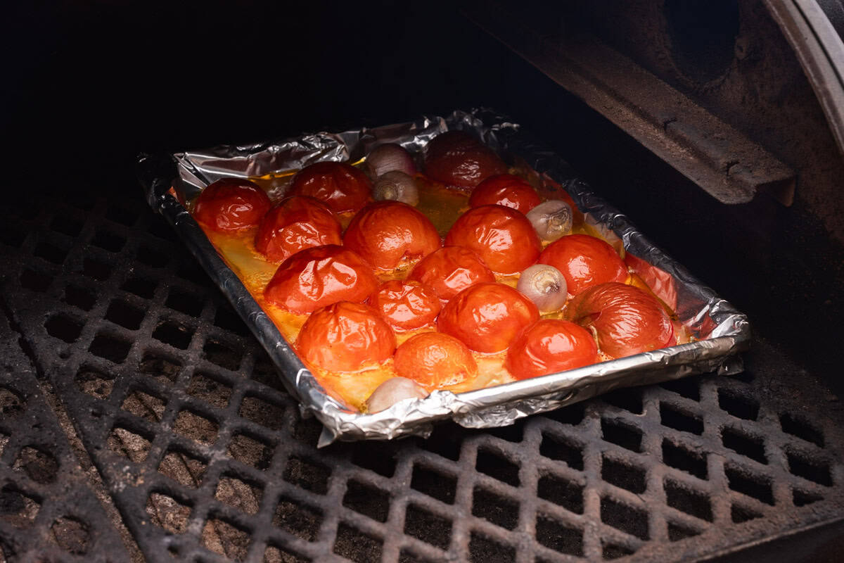 tomatoes and shallots smoking in pellet smoker.