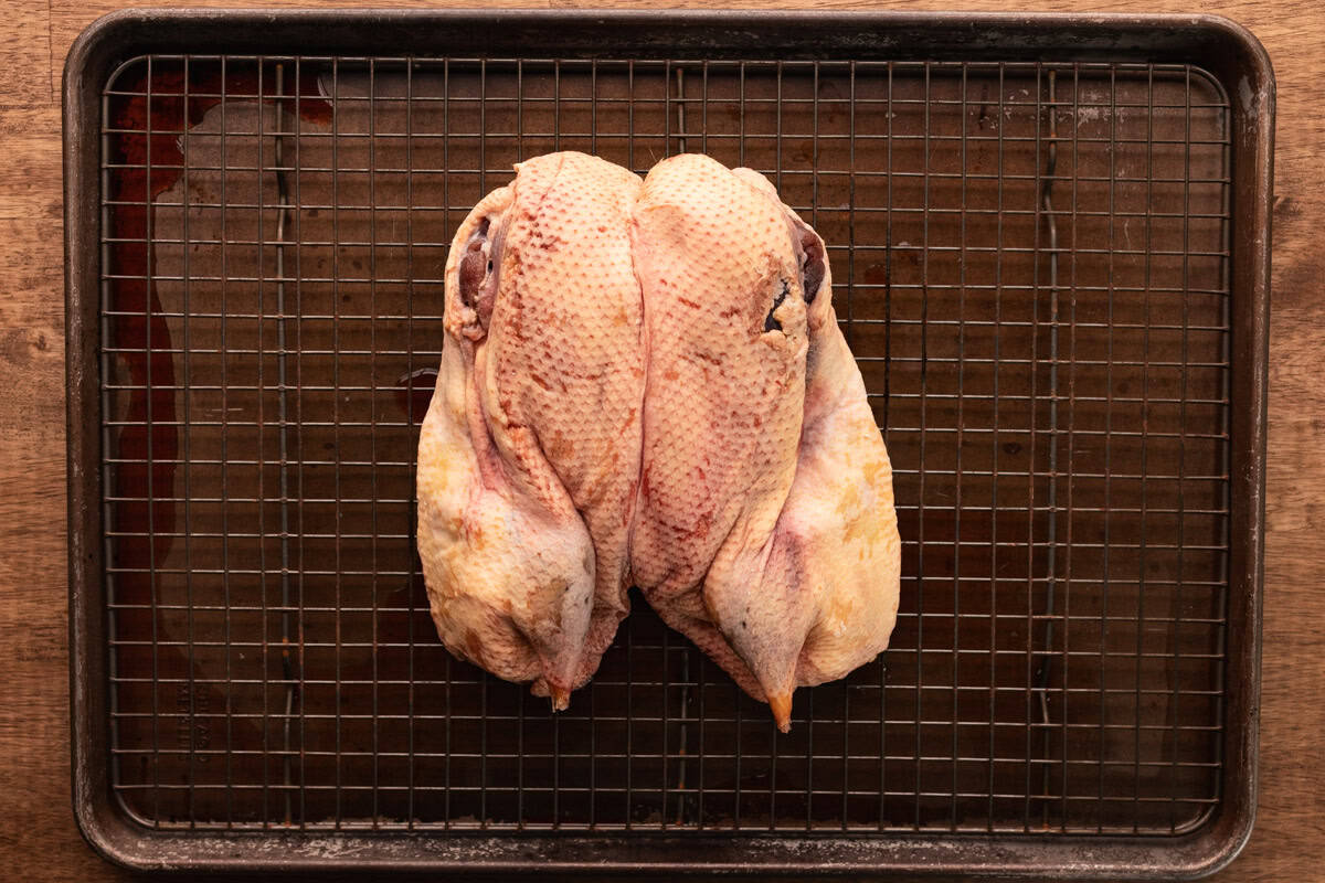 brined duck on baking rack.