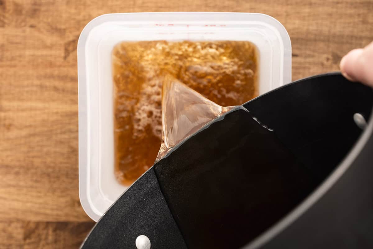 pouring brine into container.