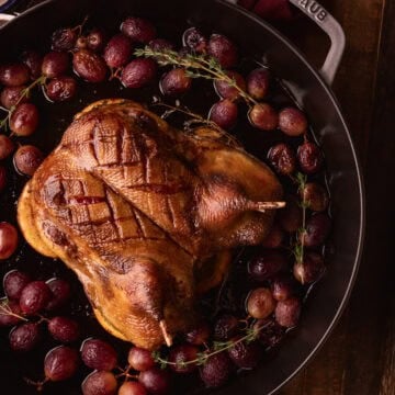 roasted duck with grapes and thyme.