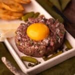 venison tartare with egg yolk.