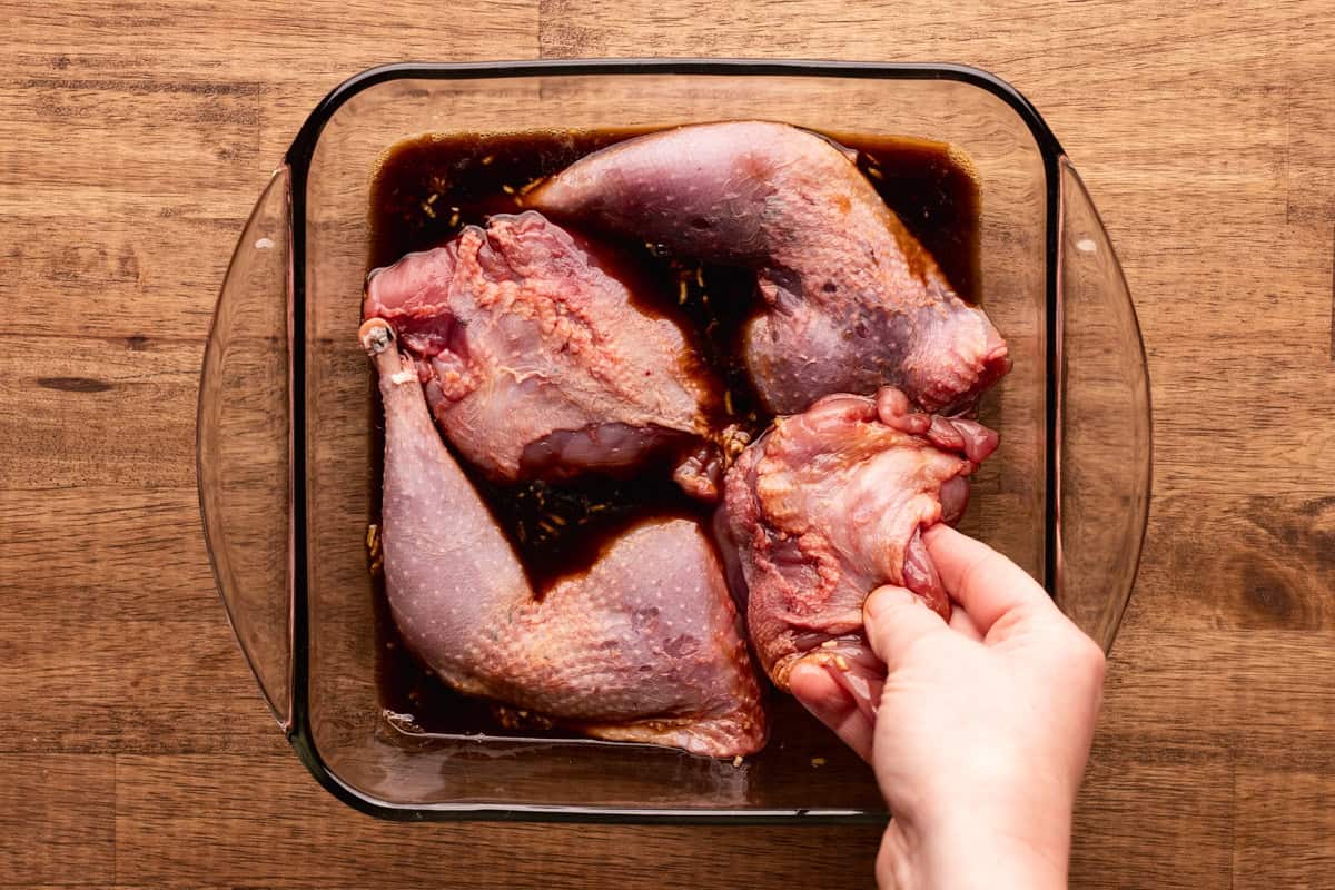 adding pheasant to adobo marinade.