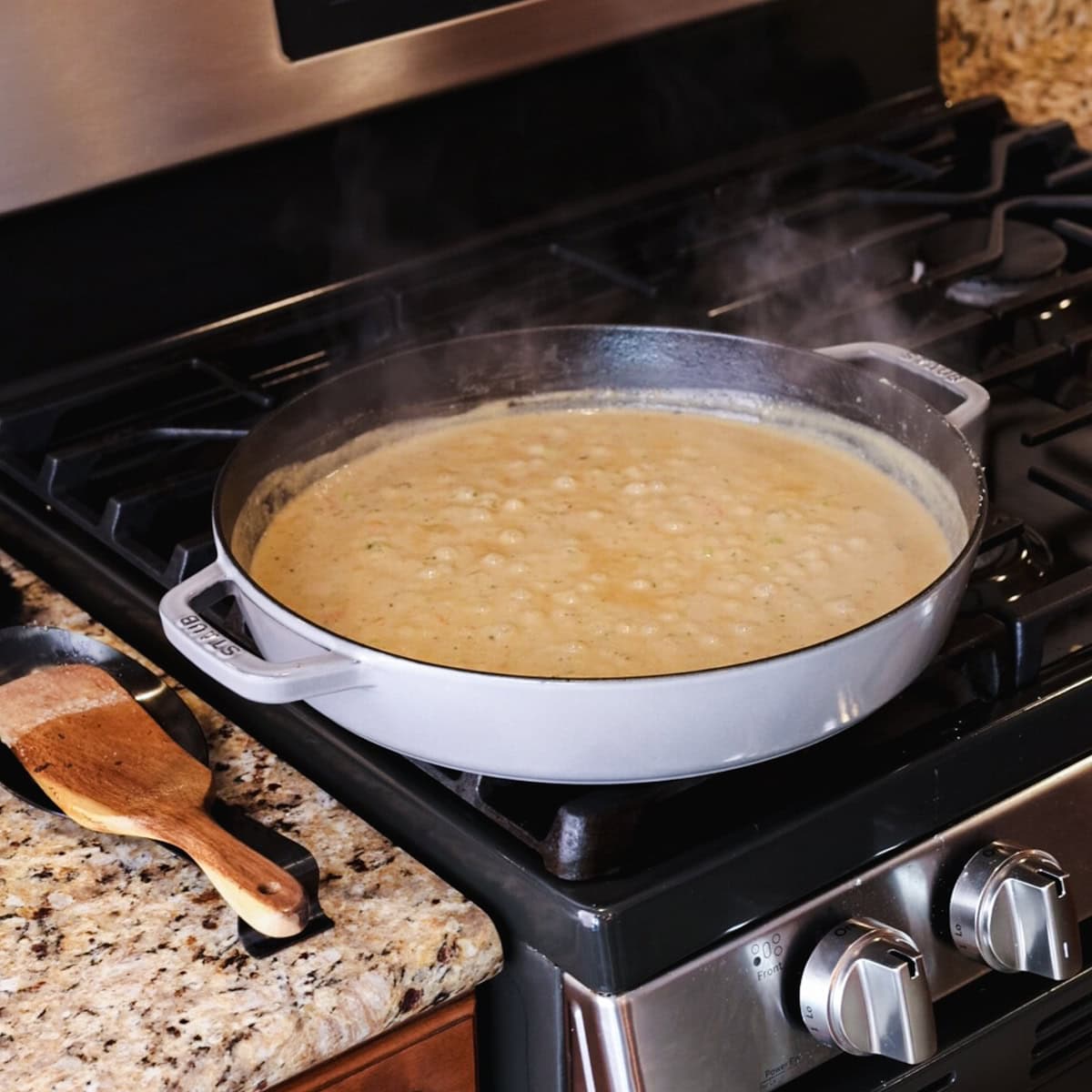 cream sauce cooking in skillet.
