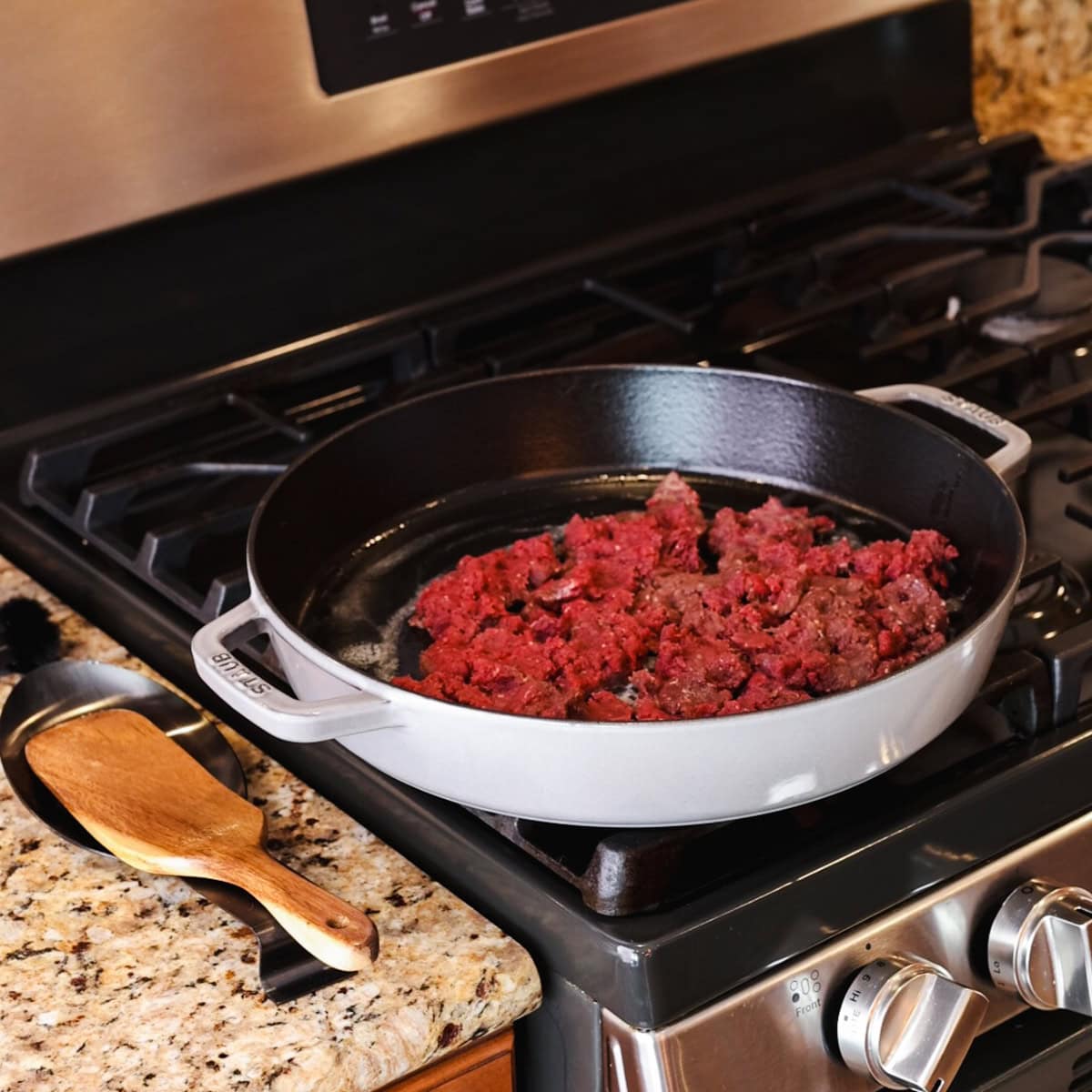 ground venison cooking in skillet.