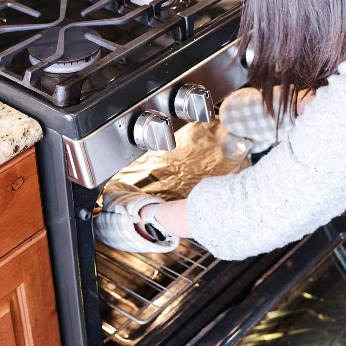 placing casserole dish in oven.