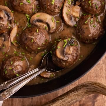 venison meatballs with marsala sauce in skillet.