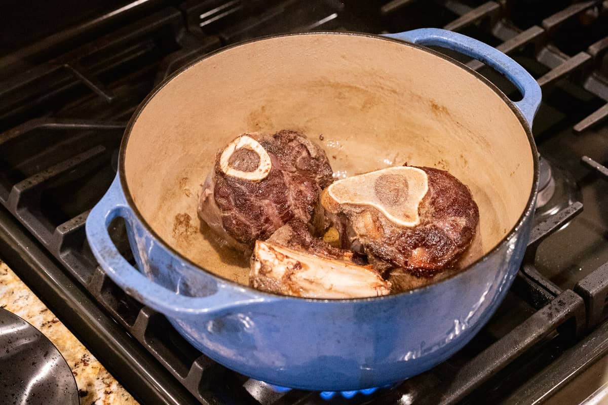 elk shanks cooking in dutch oven.