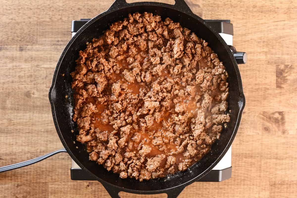 venison taco meat simmering in pan.