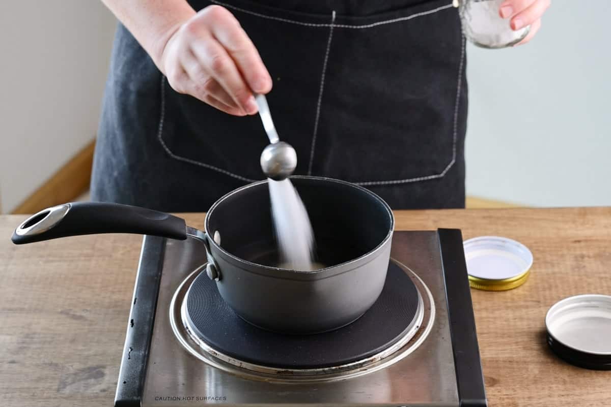 adding salt to small saucepan.