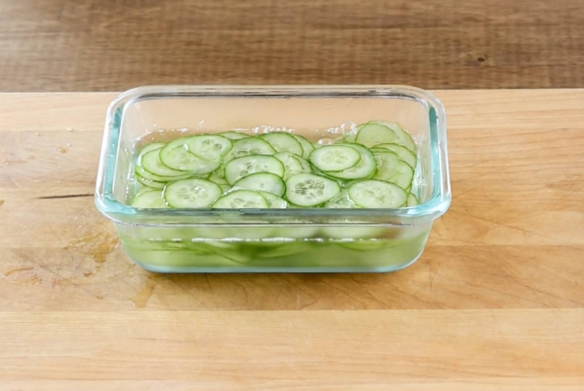 pickled cucumbers in dish.