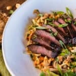grilled elk steak soba noodle bowl with peanut sauce.