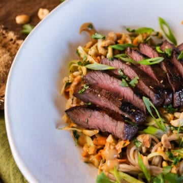 grilled elk steak soba noodle bowl with peanut sauce.
