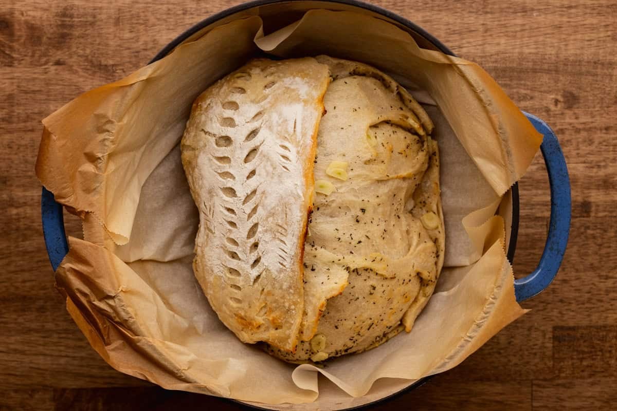 half baked sourdough loaf in dutch oven.