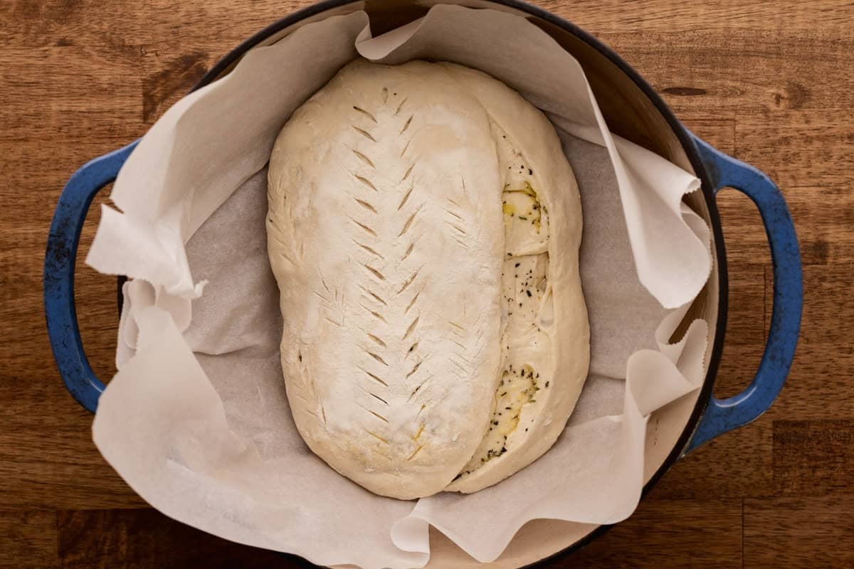 unbaked sourdough loaf in dutch oven.